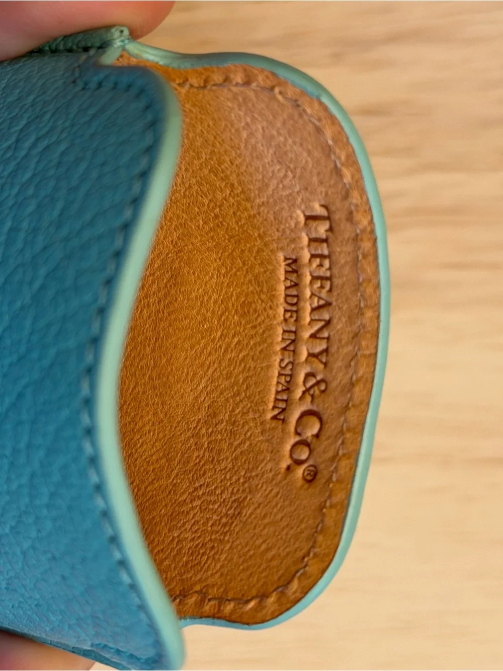 Tiffany & Co. turquoise pebbled leather phone sleeve with gold logo